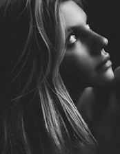 A close-up of a graceful AI-generated digital portrait with soft lighting.