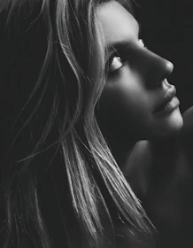 A close-up of a graceful AI-generated digital portrait with soft lighting.