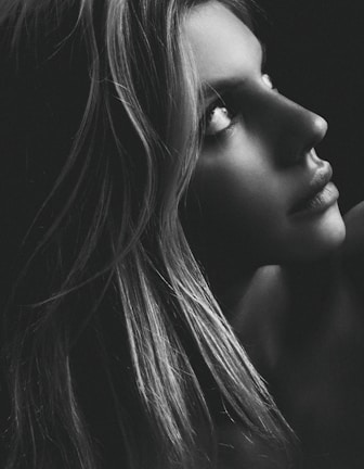 A detailed portrait sketch of a thoughtful person with expressive eyes and soft shading.