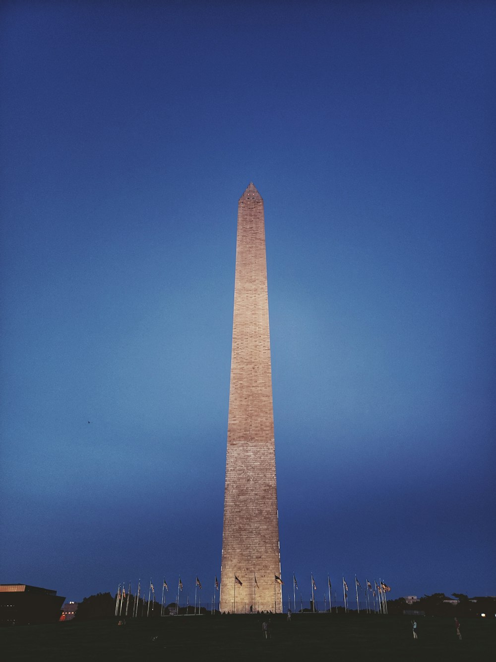 brown concrete tower under blue sky