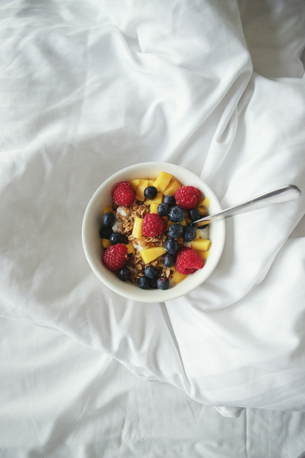 white ceramic bowl with fruits