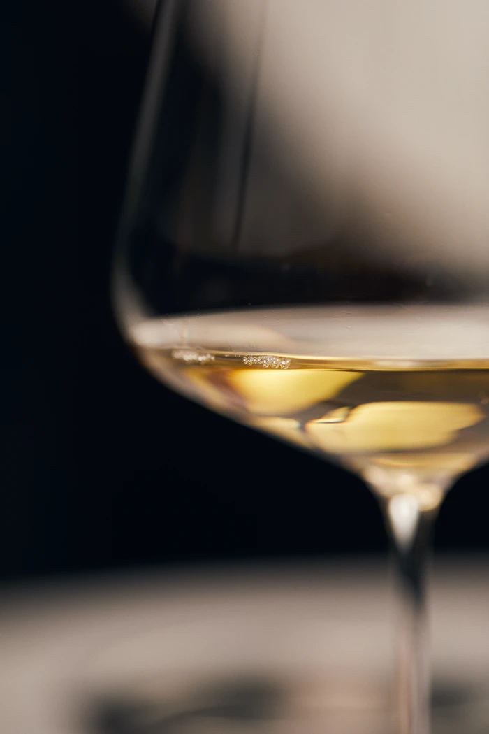 Chilled glass of golden white wine