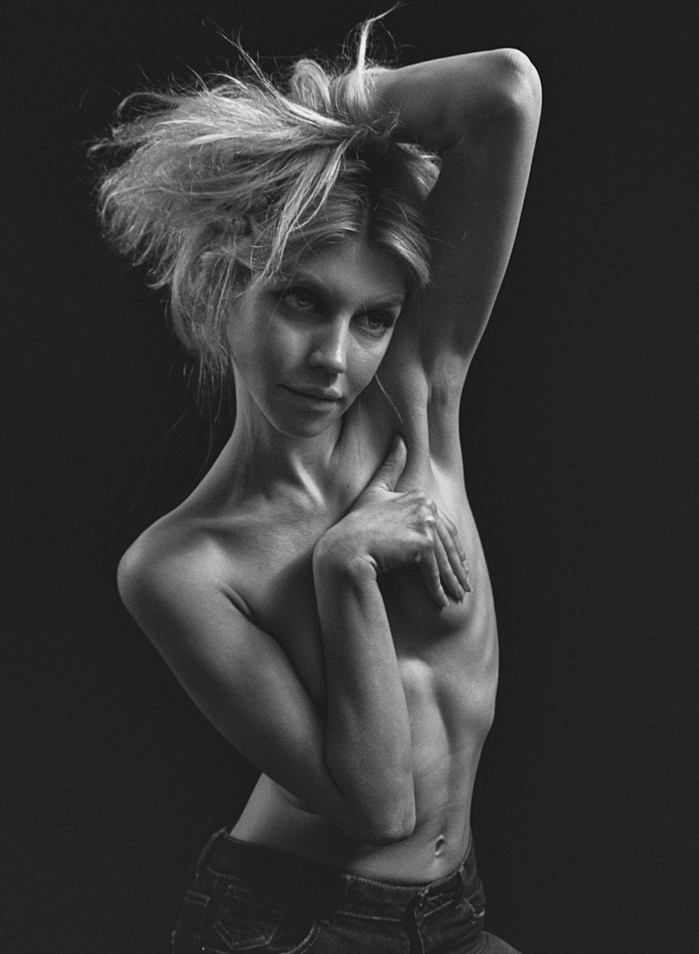 a naked woman posing for a black and white photo