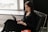 woman in black long sleeve shirt using macbook