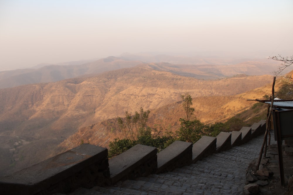 a view of a mountain range from the top of a hill