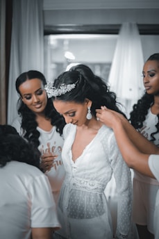 woman in white lace dress smiling