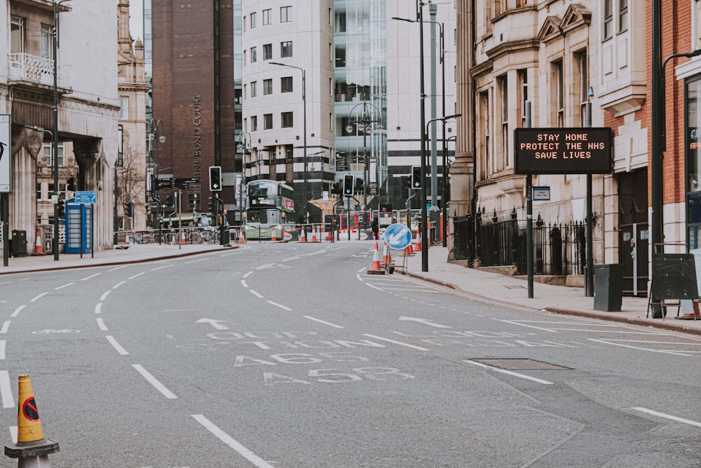 people crossing on pedestrian lane during daytime