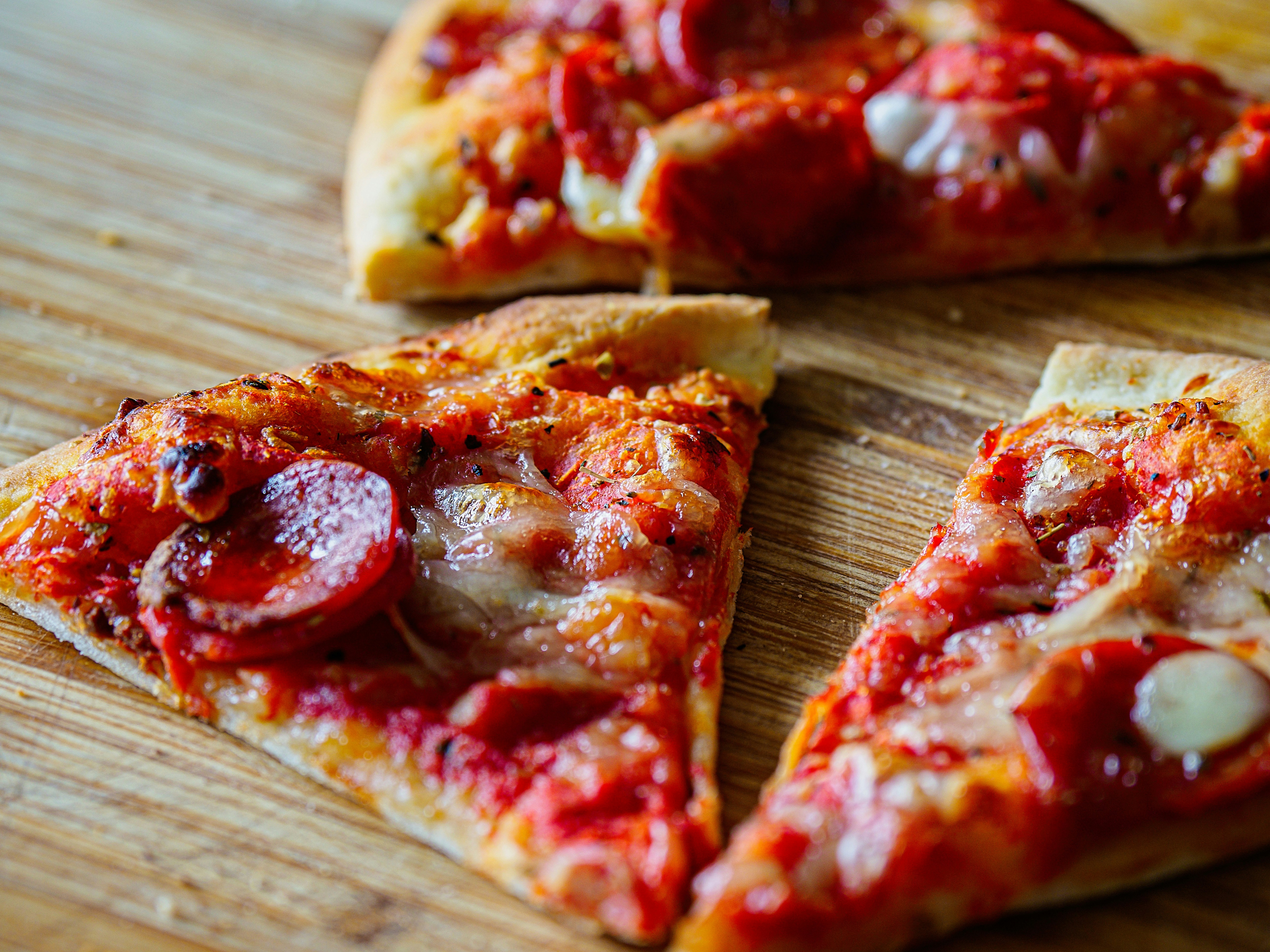 Sliced pizza on a wooden table