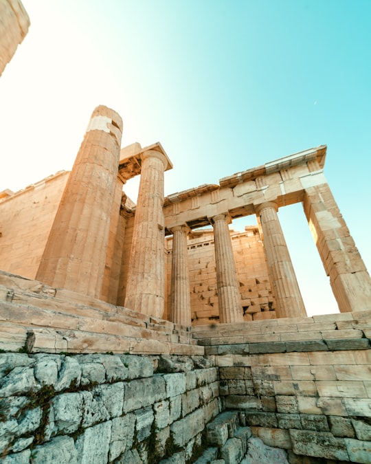 brown concrete building under blue sky during daytime in Acropolis of Athens Greece