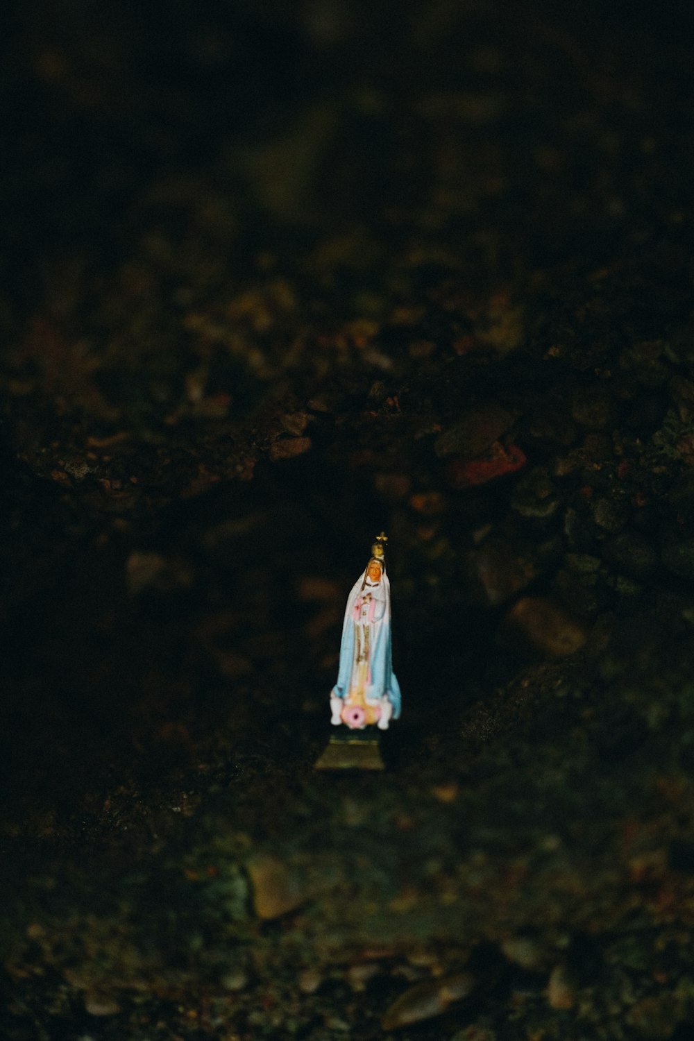 woman in white dress standing on rock