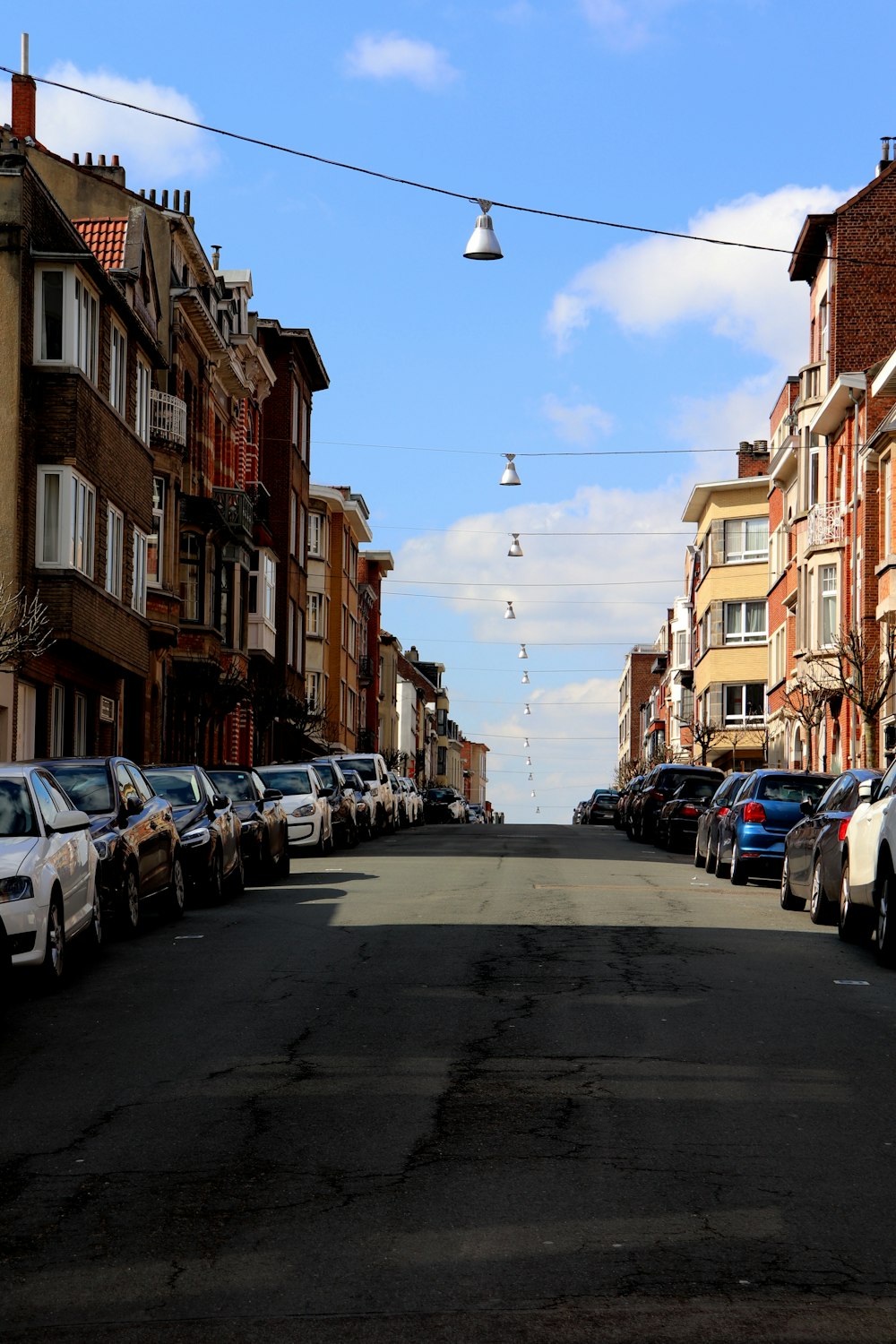 cars parked on side of the road during daytime