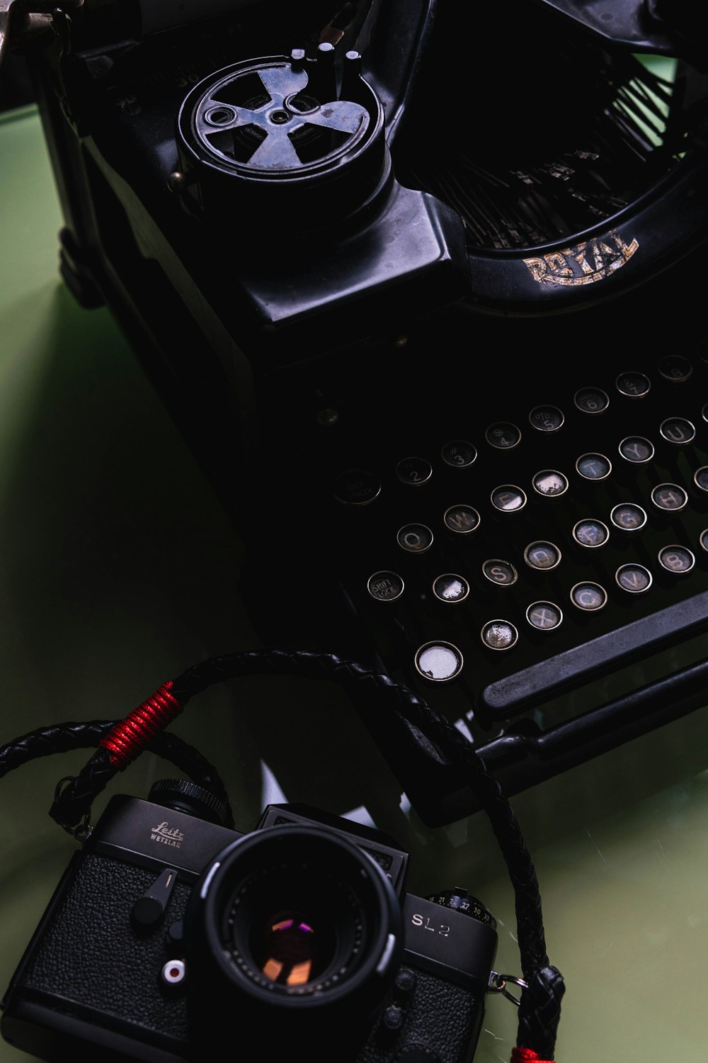 black typewriter on green table