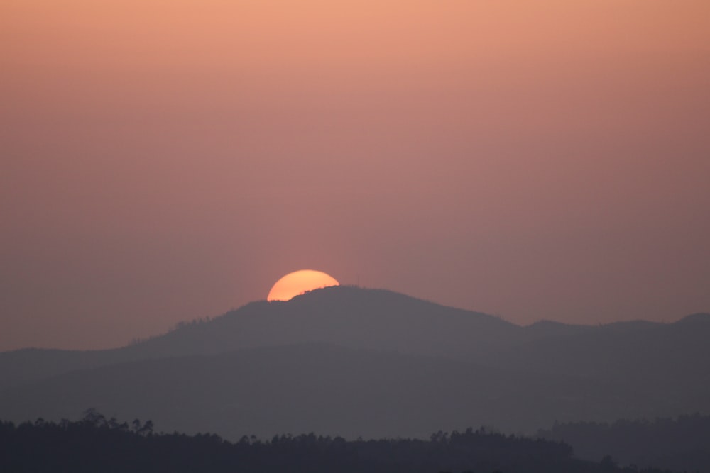 silhouette of mountain during sunset