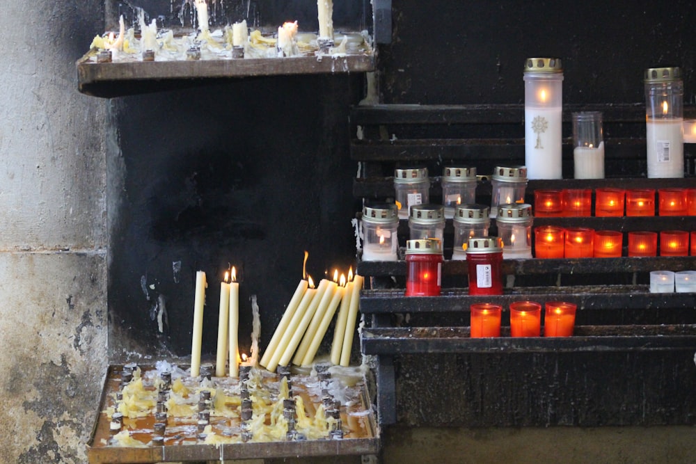 white candles on black table