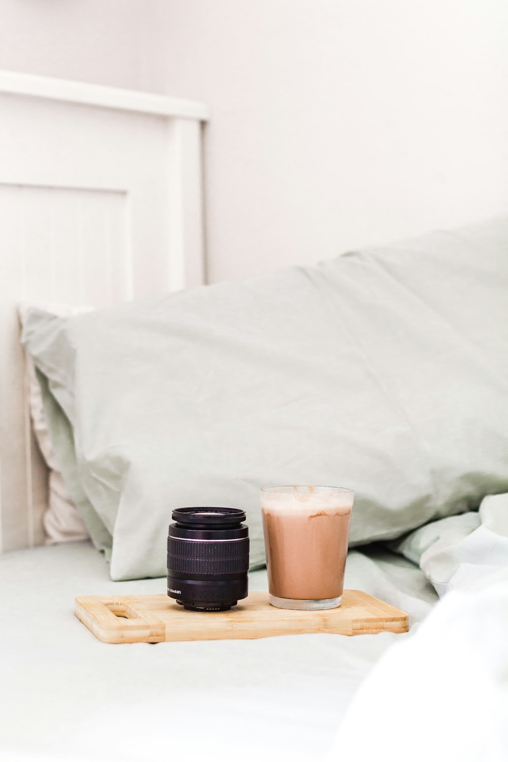 black and brown coffee cup on brown wooden table