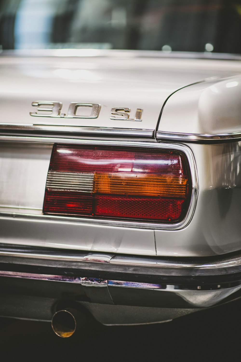 white and black car in close up photography