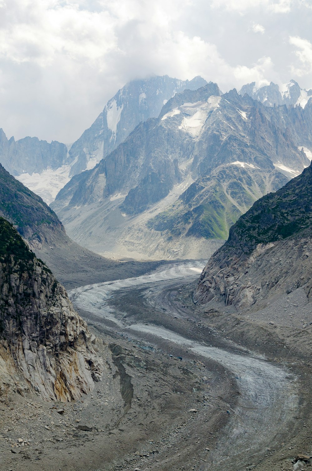 gray and white mountains under white sky during daytime