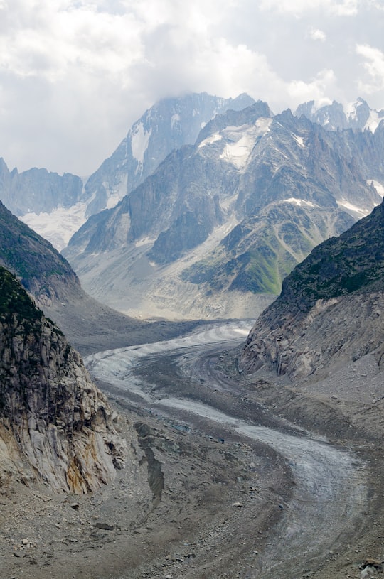 gray and white mountains under white sky during daytime in Mer de Glace France