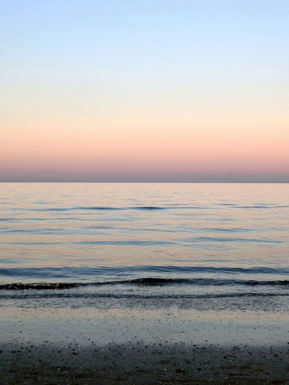 ocean water under blue sky during daytime