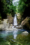 waterfalls in the middle of the forest