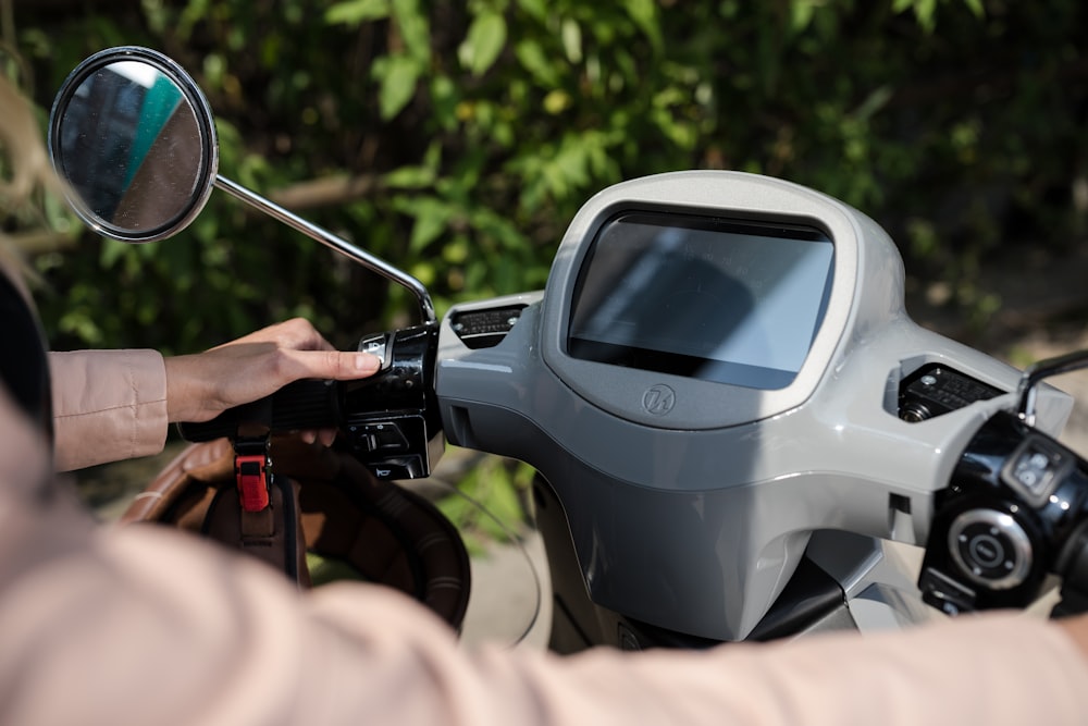 person holding black and silver dslr camera