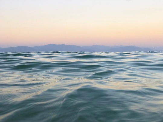 body of water under white sky during daytime in Sevan Lake Armenia