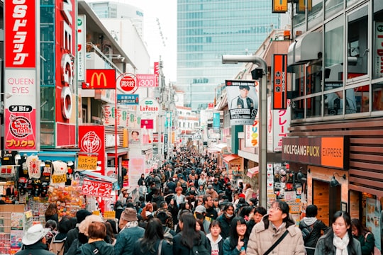 people walking on street during daytime in Takeshita Street Japan