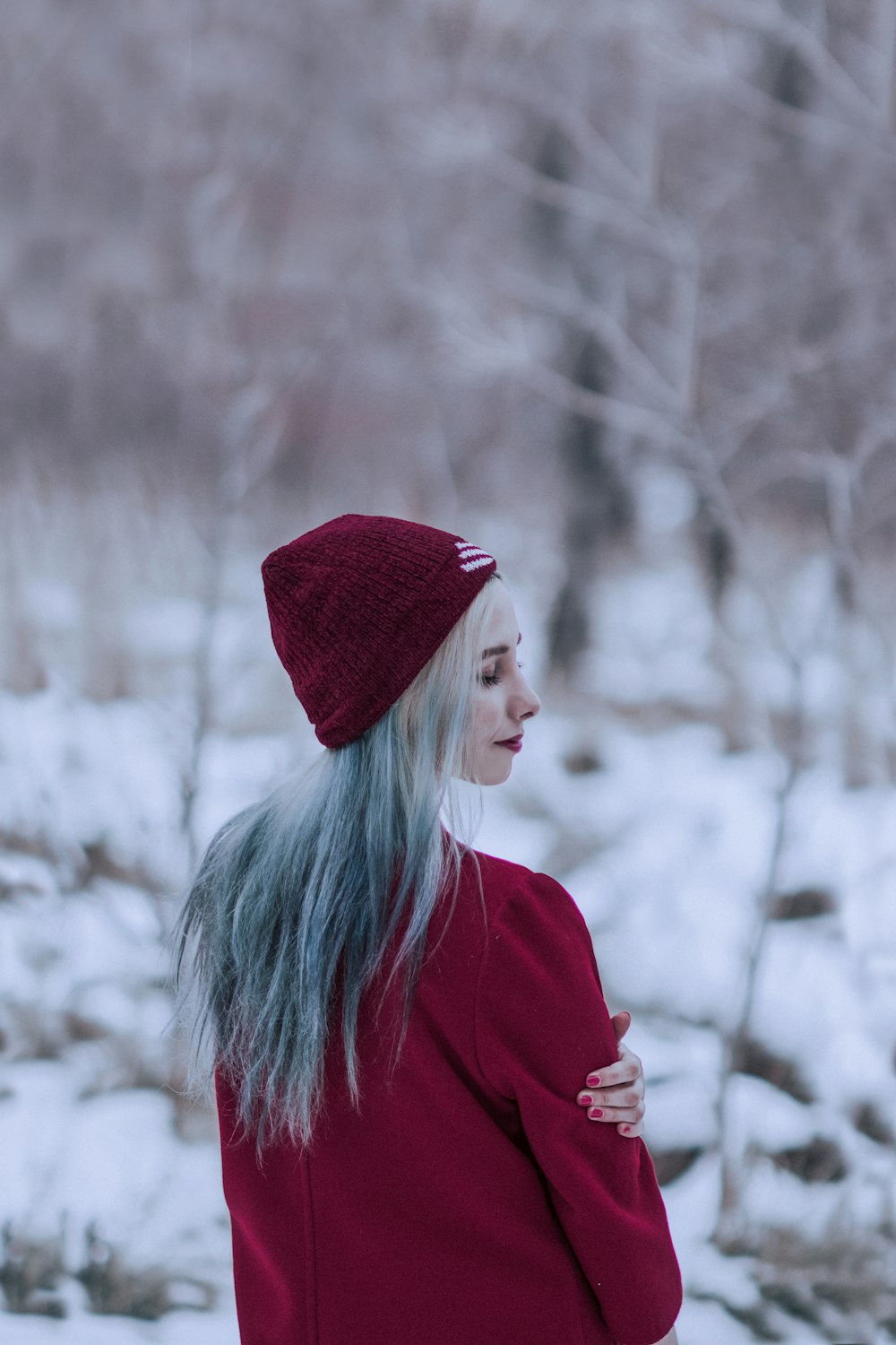 woman in red knit cap and red sweater