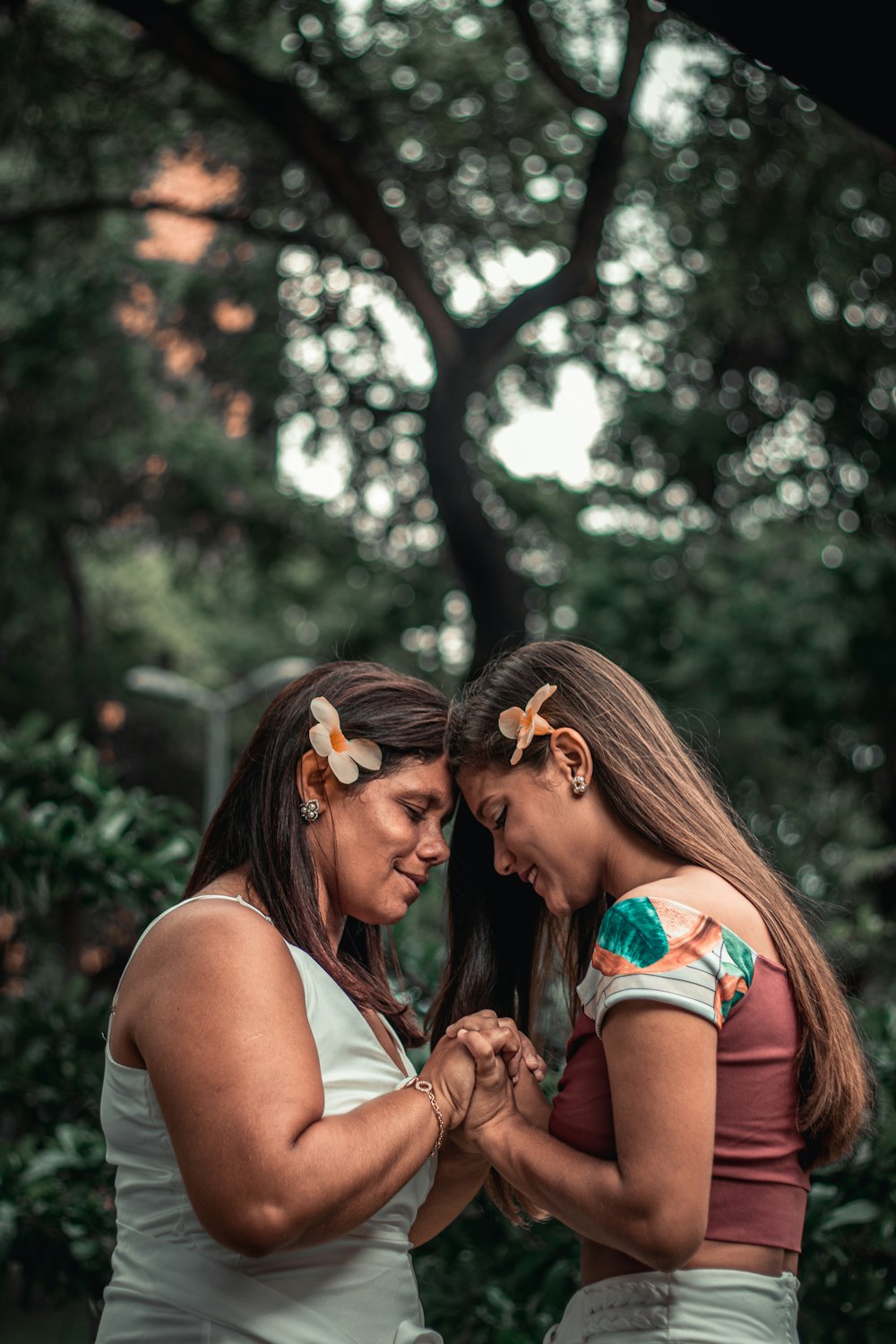 woman in white tank top with brown and black butterfly on her face