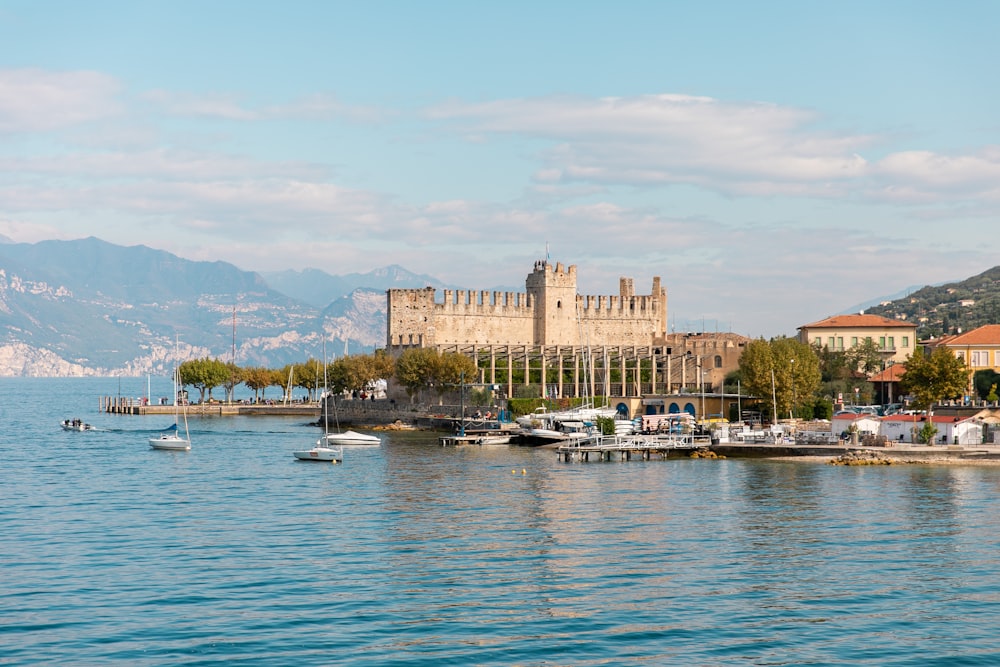 brown concrete building near body of water during daytime