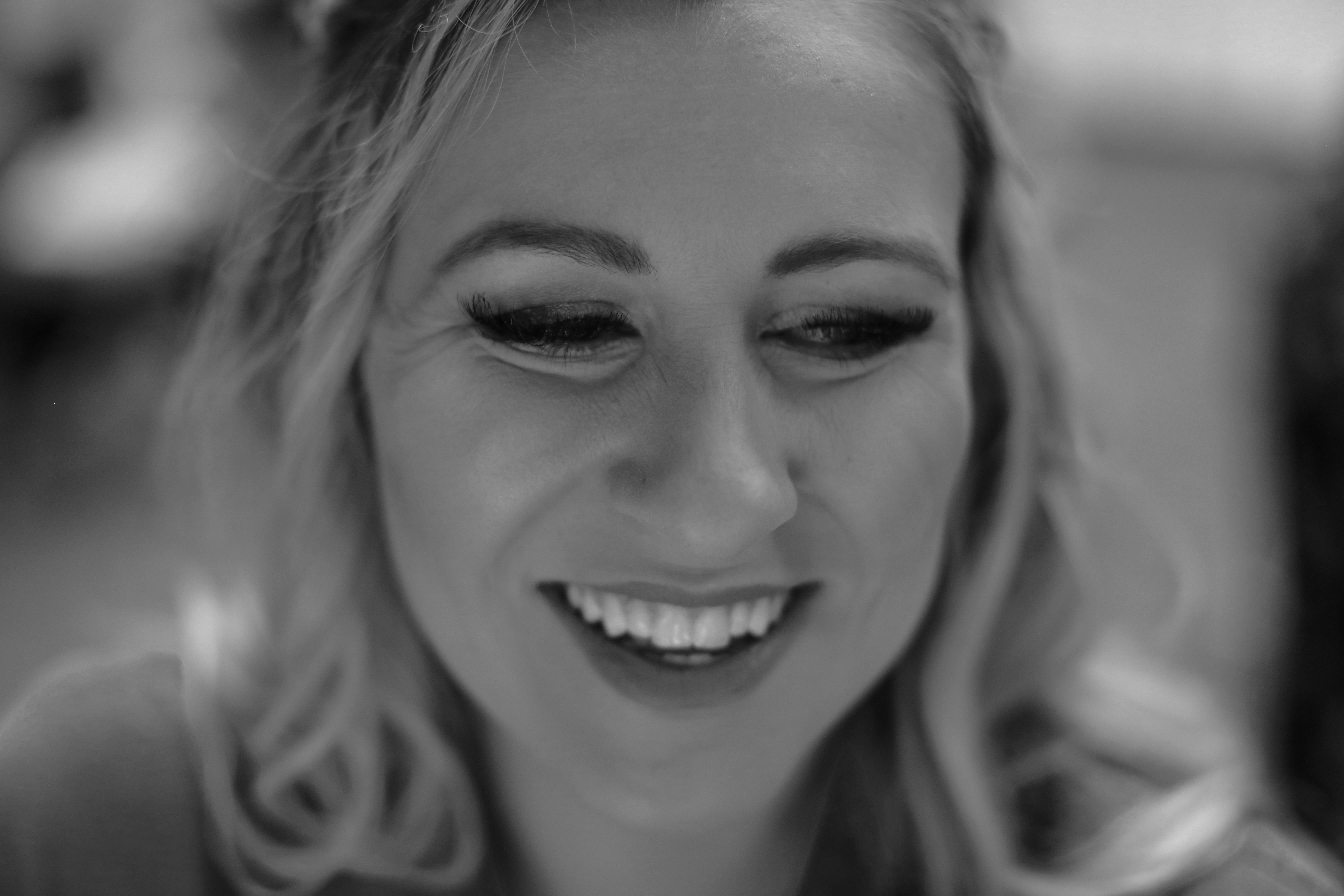 grayscale photo of smiling woman