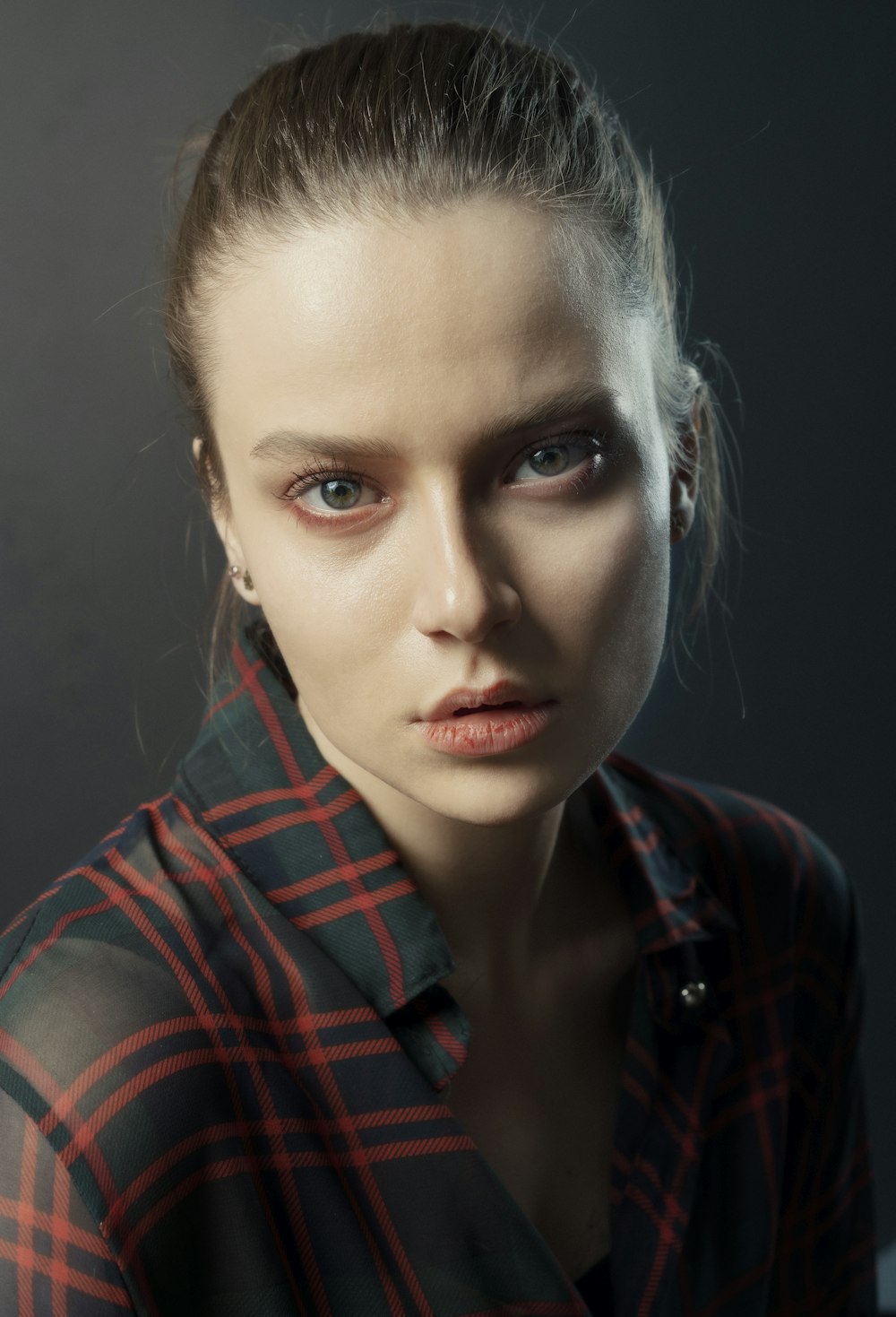 woman in red and black plaid shirt