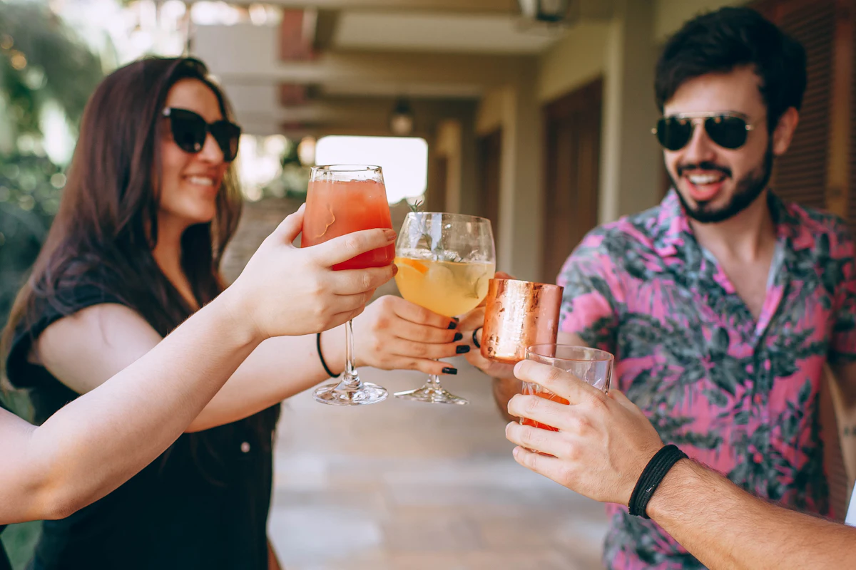 Friends toasting with cold drinks