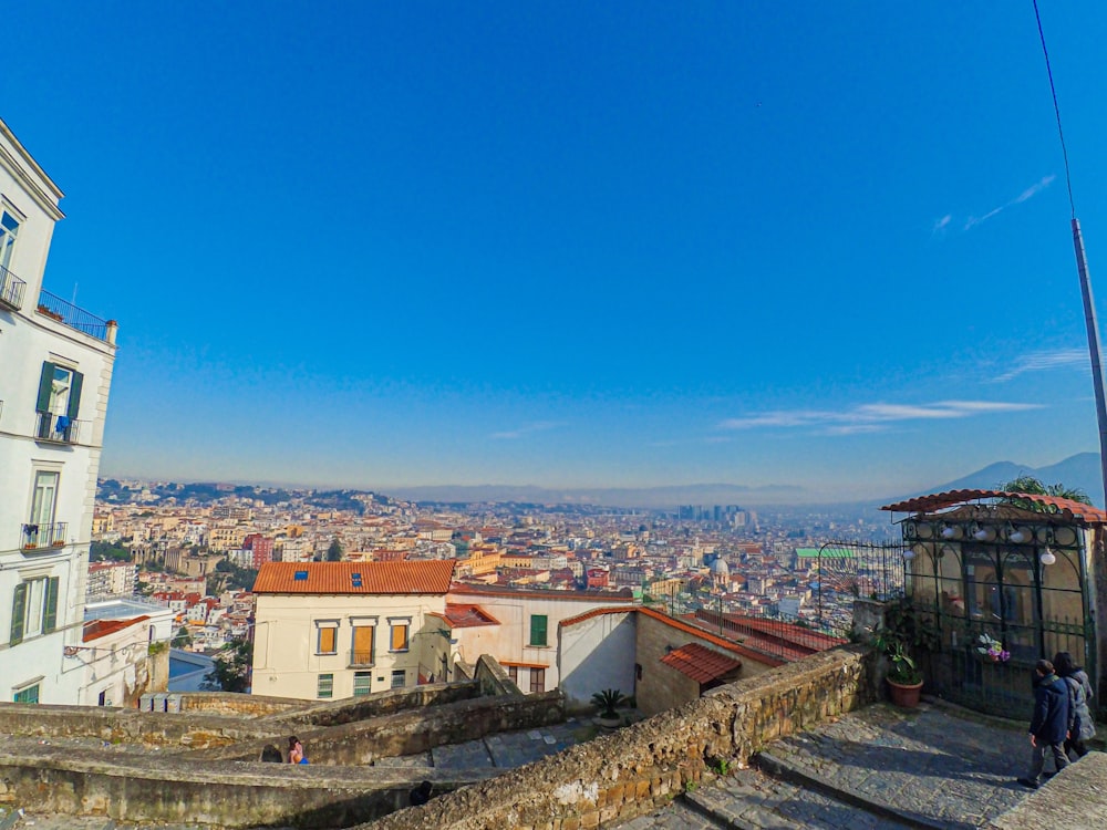 white and brown concrete houses under blue sky during daytime