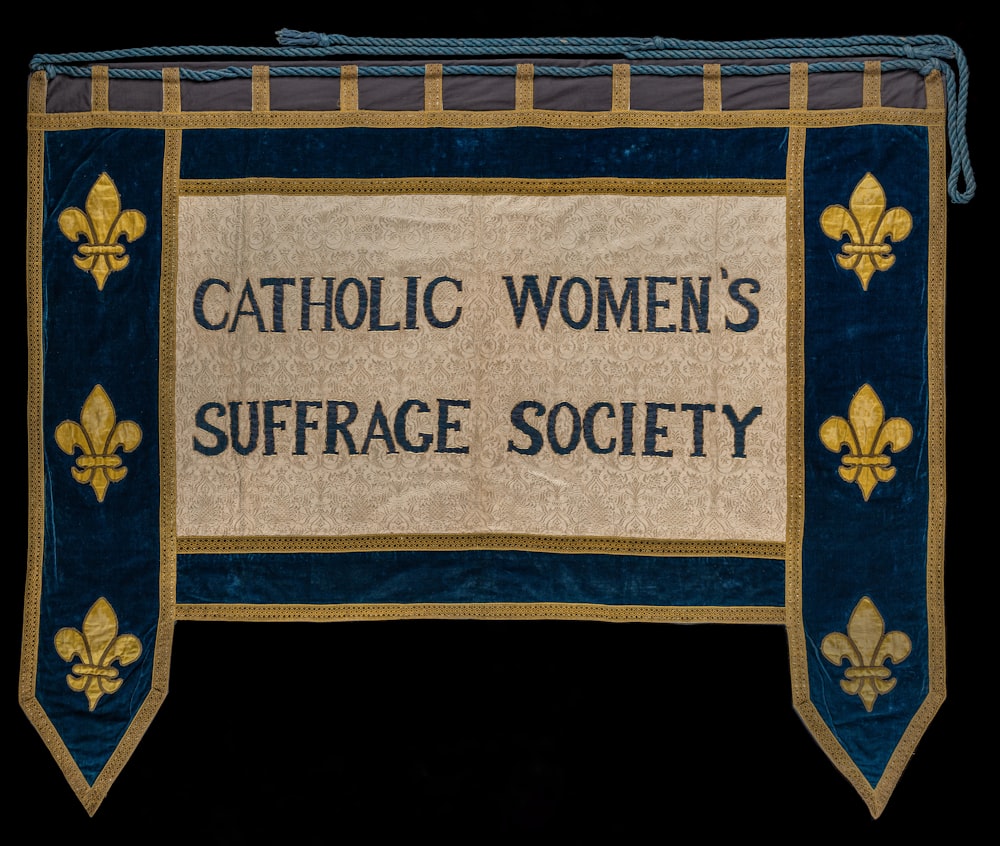 a sign that says catholic women's surface society