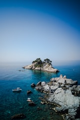 white and blue boat on sea during daytime