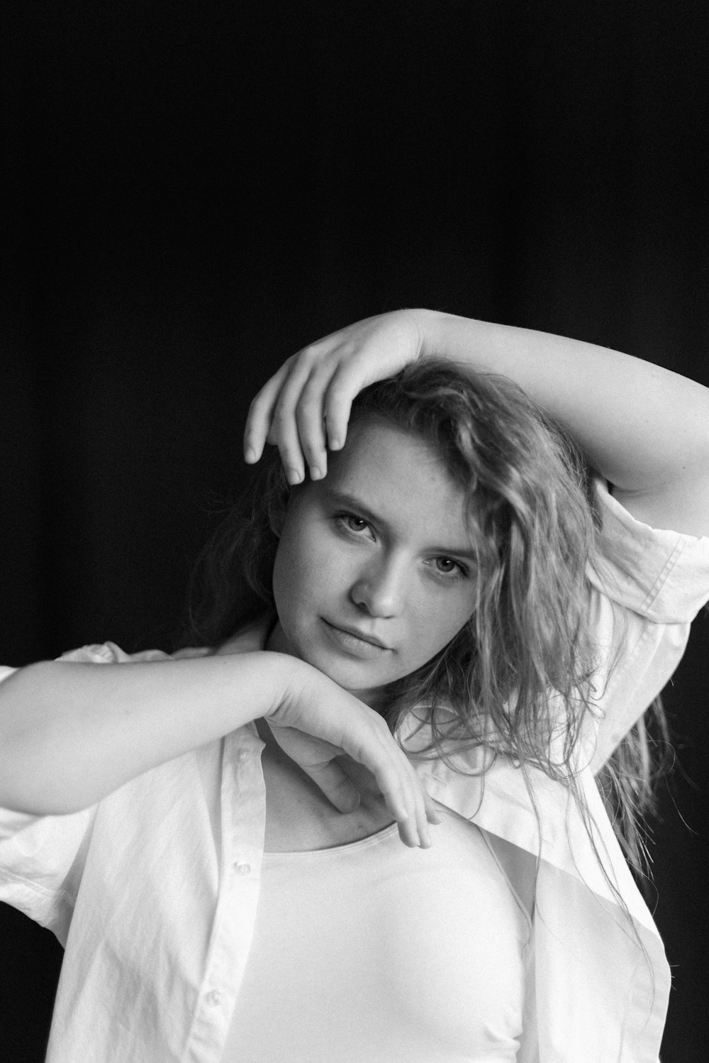 grayscale photo of woman in white shirt