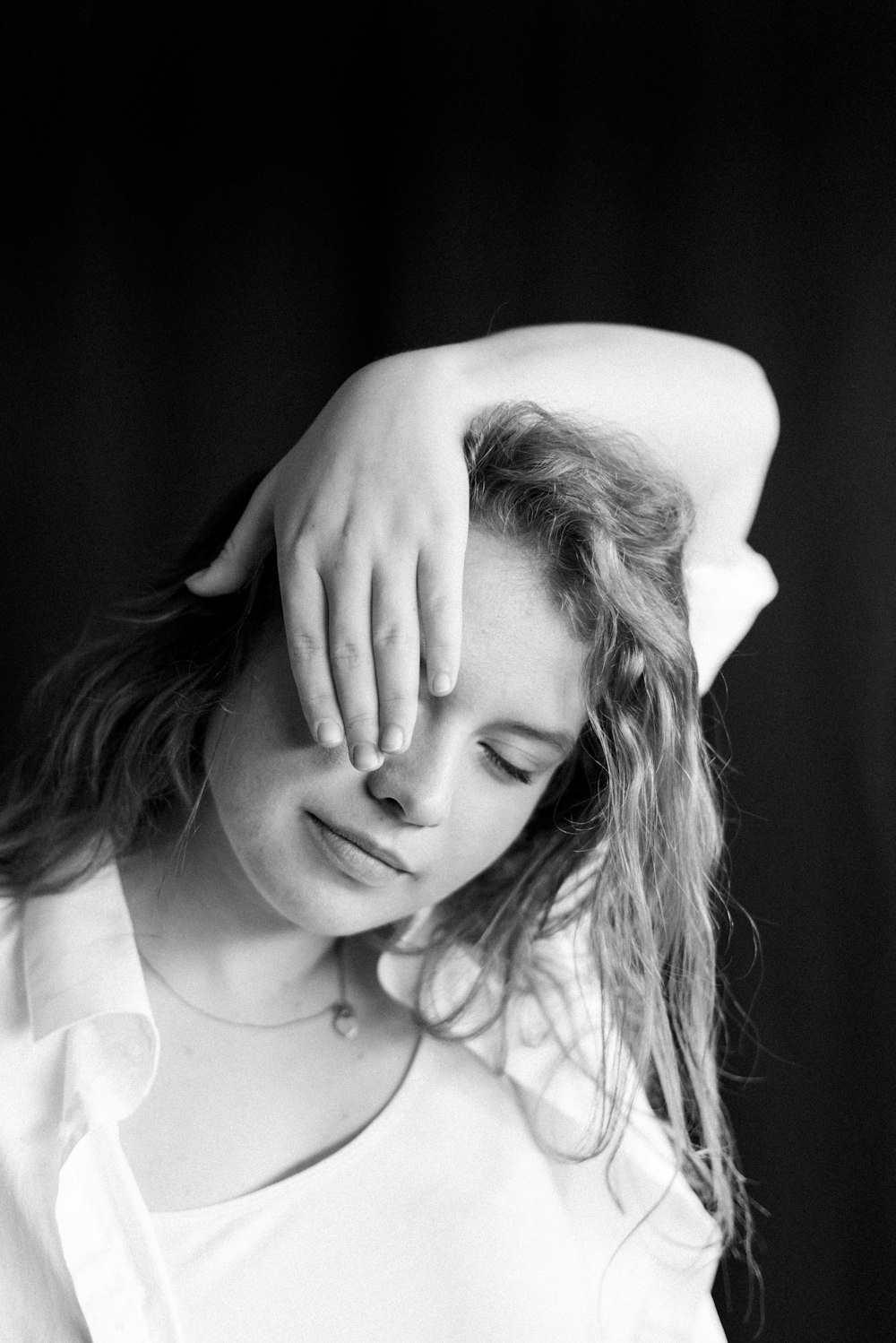 grayscale photo of woman in white shirt