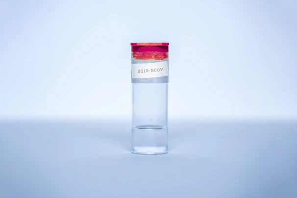 High-resolution image of a certificate of analysis document beside a cobalt blue capped peptide vial.