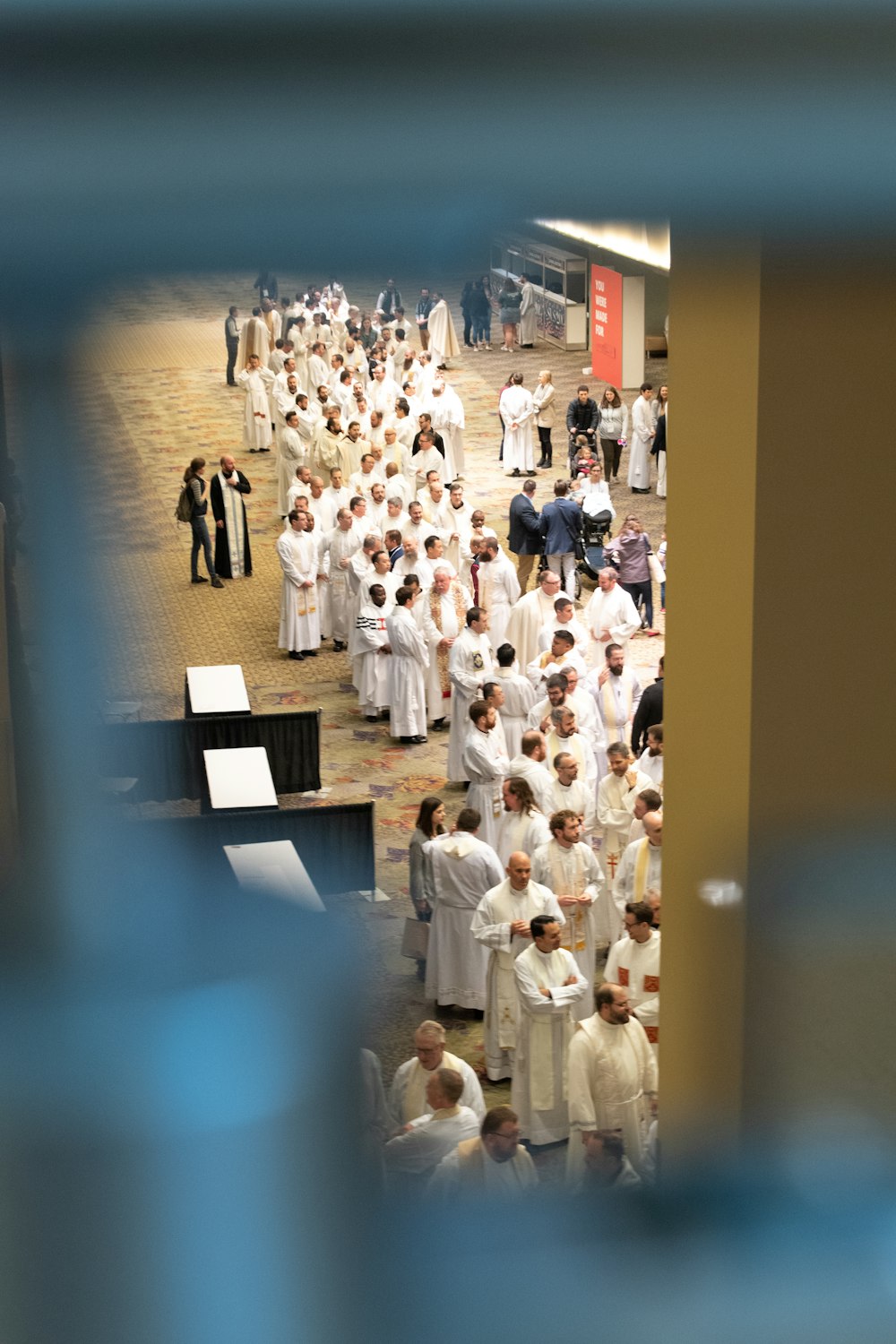 white dress shirts hanging on white wooden rack