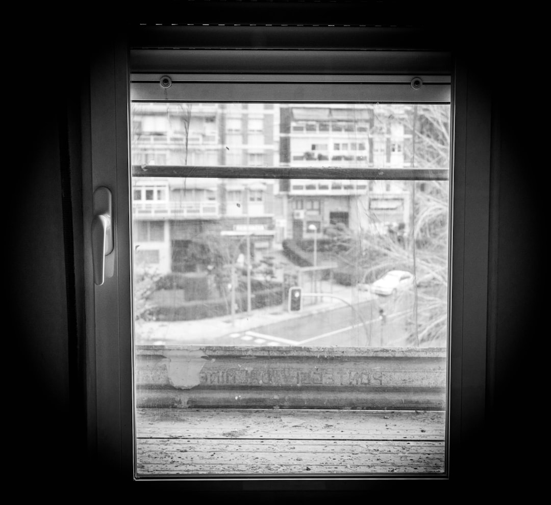 grayscale photo of glass window