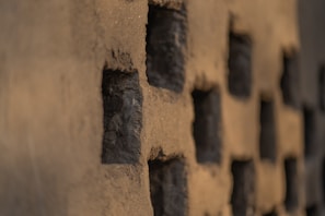 Close-up of a textured concrete wall showcasing material detail and craftsmanship.