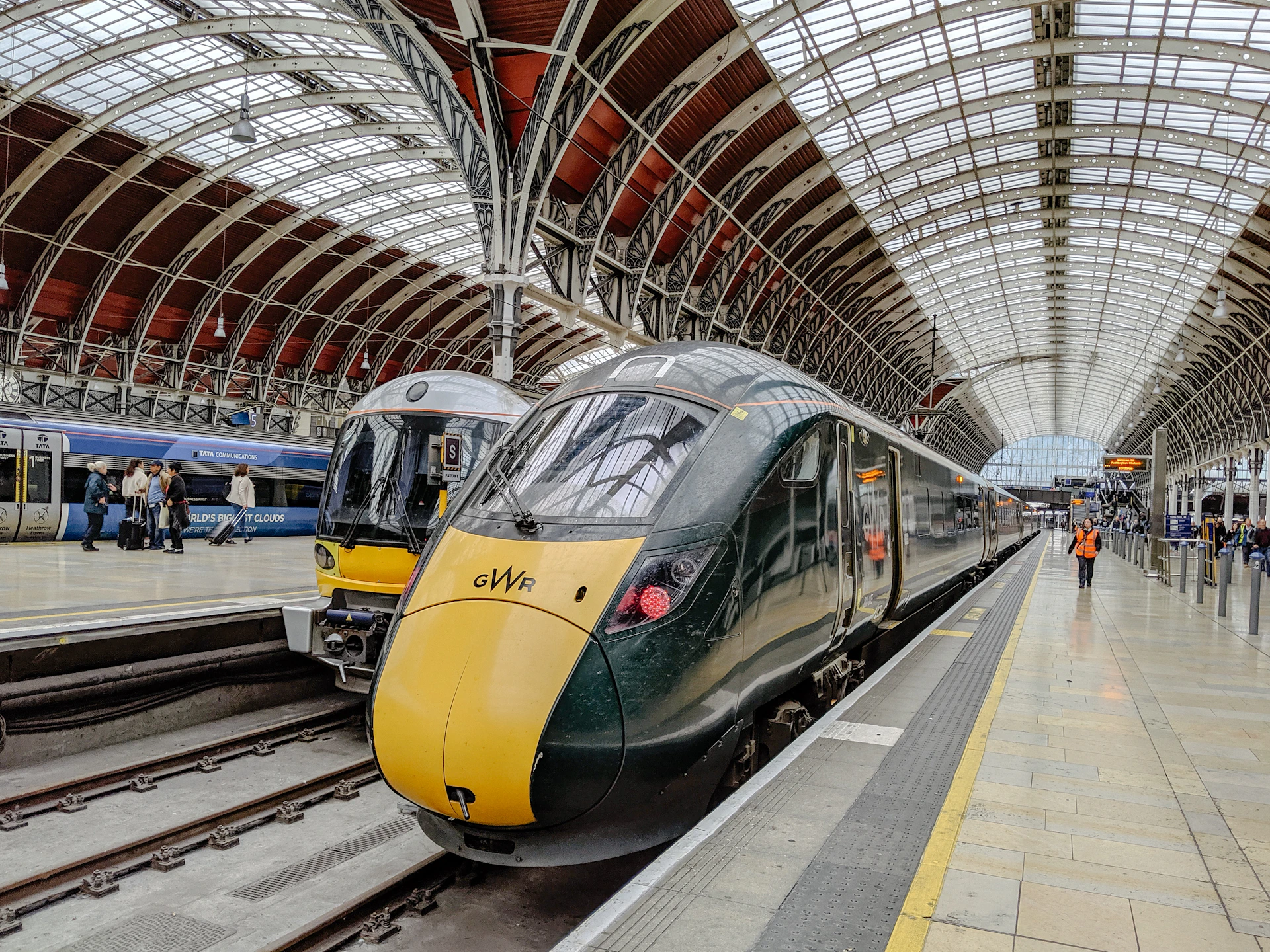 yellow and black train in train station