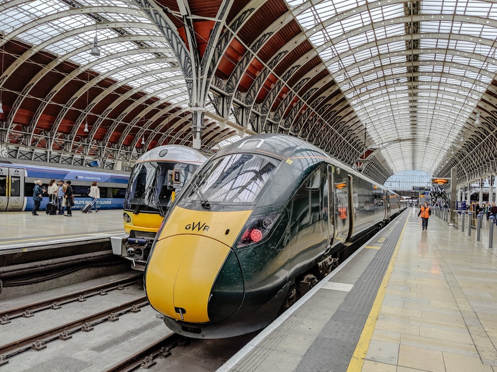 yellow and black train in train station