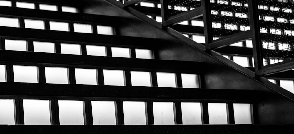 a black and white photo of a stair case