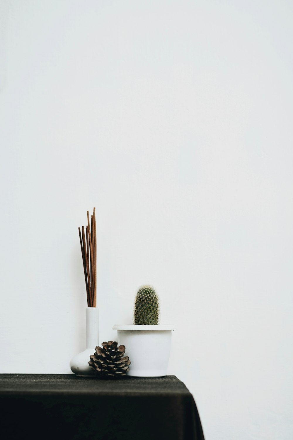 white ceramic cup with brown sticks