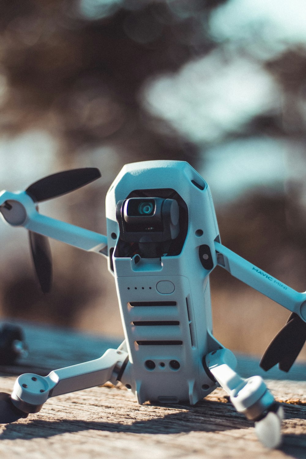 blue and black drone in close up photography