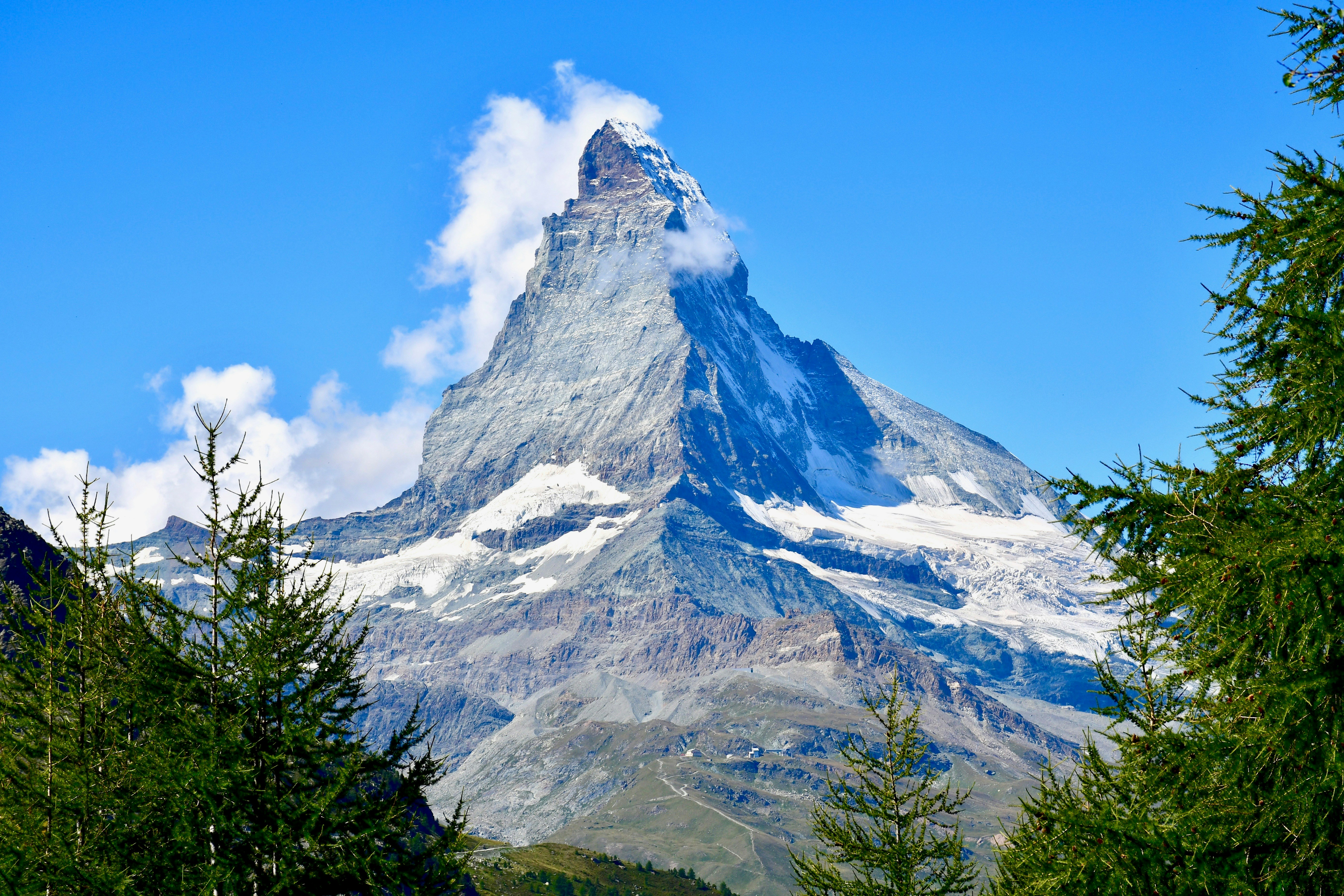 snow covered mountain under blue sky during daytime