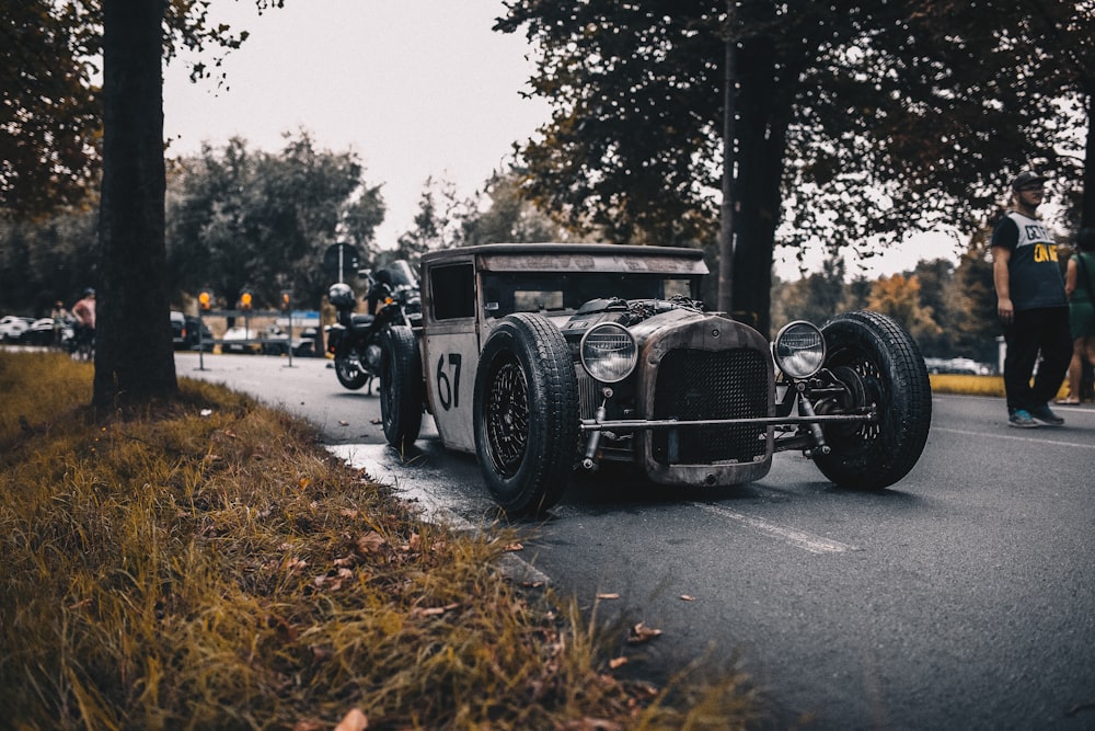 vintage black car on road during daytime
