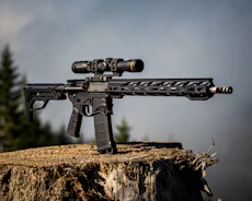 Shooter practicing precision with a rifle in a wooded setting